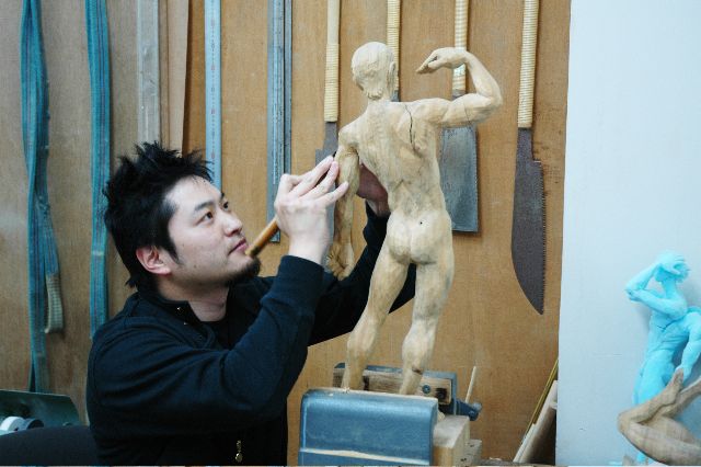 金巻芳俊